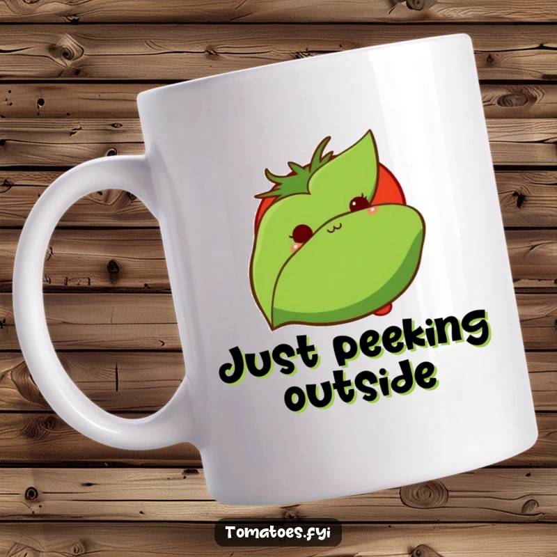 Funny mug features a shy tomato peeking out from behind a green leaf, conveying bashfulness and gentle humor.
