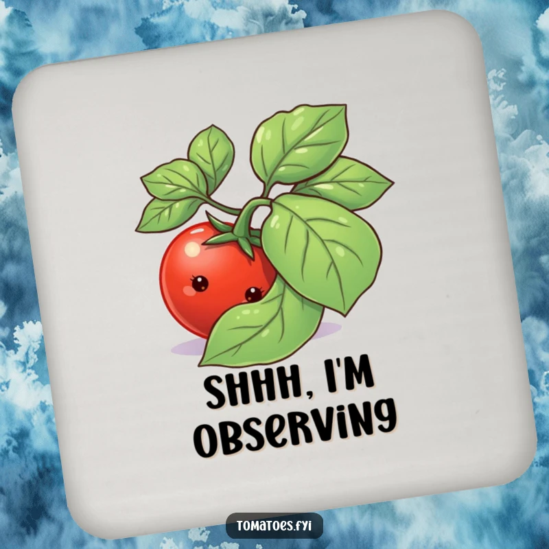 Funny shy tomato character peeking from behind a basil leaf on a round drink coaster.