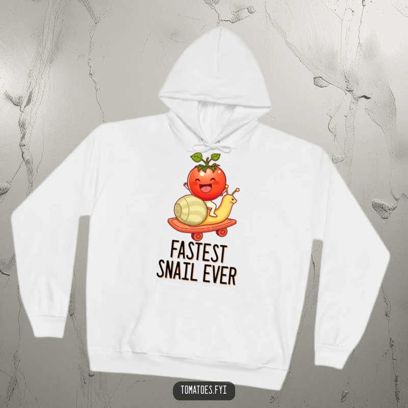 Funny tomato character having a blast riding a snail like a rollercoaster on this cozy hoodie, a delightful scene.