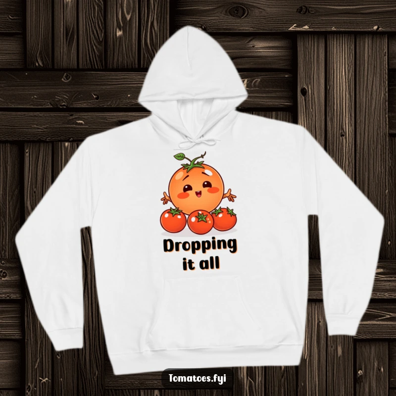 Funny tomato character comically juggling smaller tomatoes, printed on a warm and comfortable hoodie.