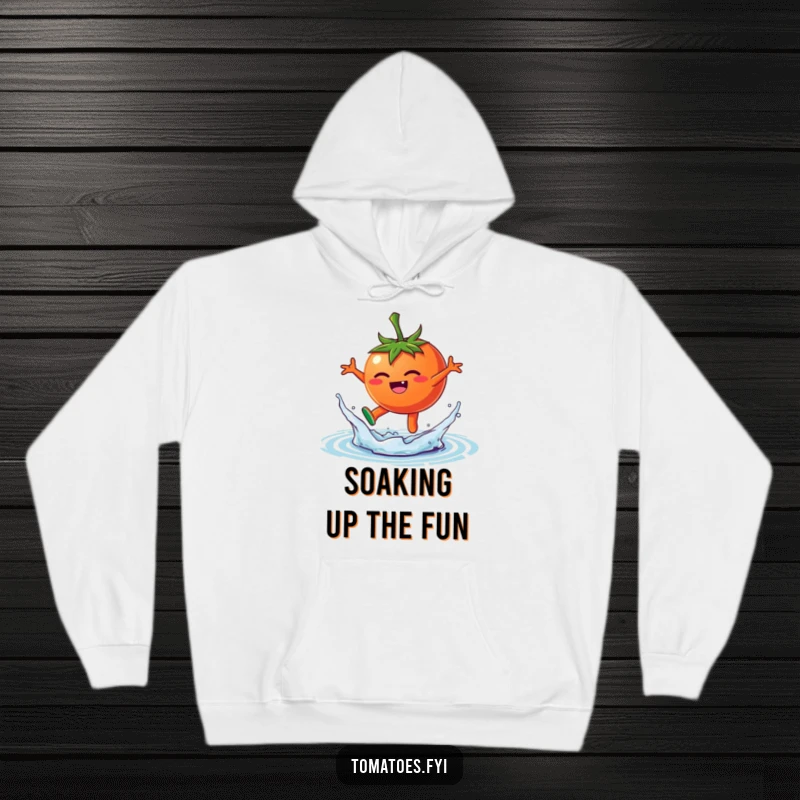 Funny hoodie featuring a happy tomato character joyfully leaping into a splash of water, embodying playfulness and fun.