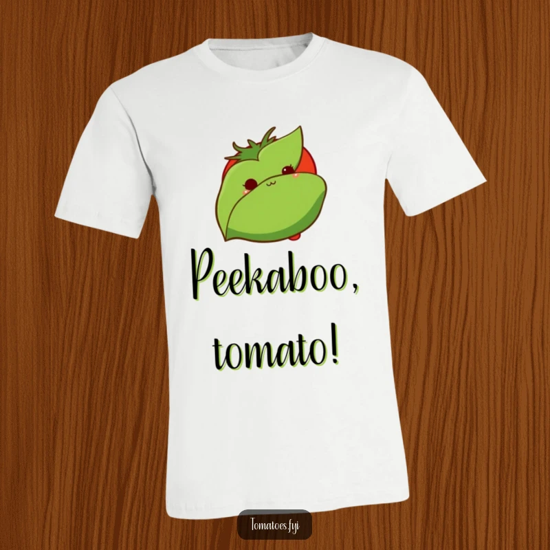 Funny t-shirt depicts a shy tomato peeking from behind a leaf, embodying a cute and humorous representation of introversion.